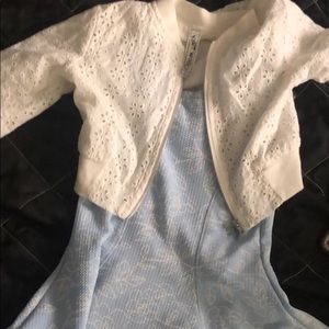 A set of two,dresses color is blue jacket is white made from knitwork size 5 kid